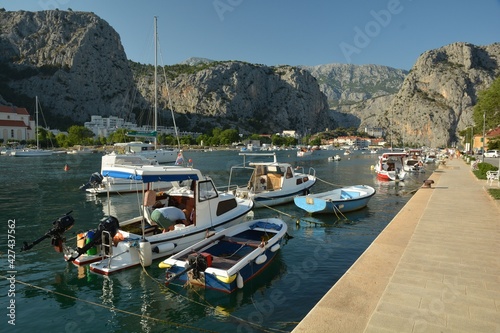 Fototapeta Naklejka Na Ścianę i Meble -  Omis port in Split-Dalmatia County in Dalmatia, Croatia, with boats and ships