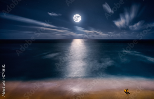 Fototapeta Naklejka Na Ścianę i Meble -  full moon rising over cancun mexico