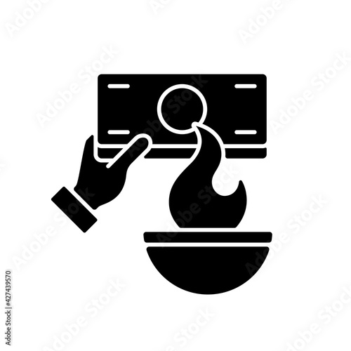 Burning money black glyph icon. Hungry ghost festival. Zhongyuanjie. Chinese culture. Visiting ancestors. Spirits coming out from realm. Silhouette symbol on white space. Vector isolated illustration