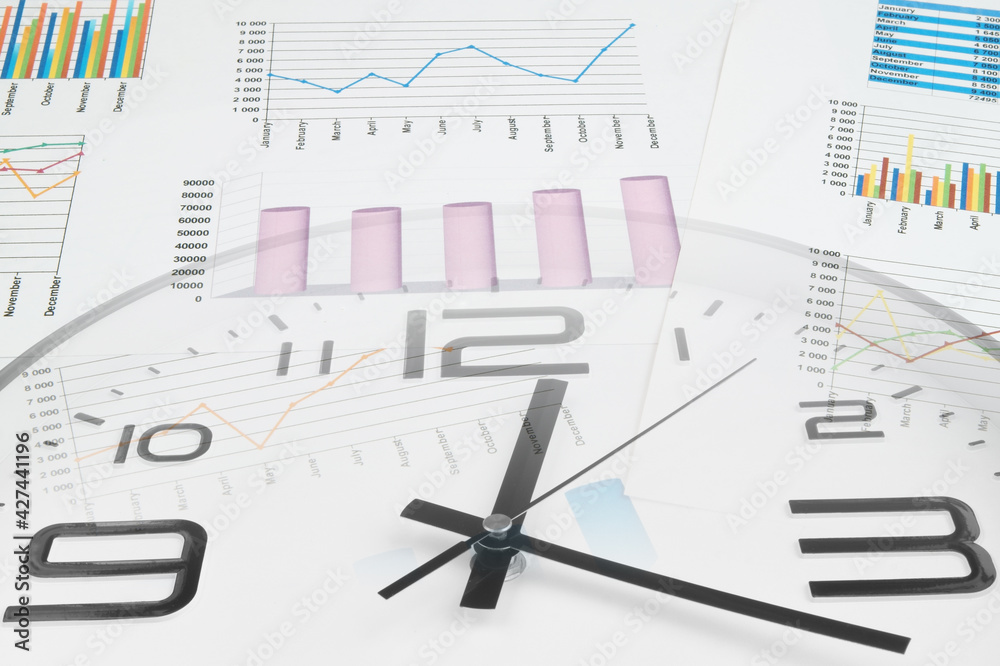 Business time and planning concept. Financial report with clock and documents. Business time and planning concept. Financial report with clock and documents.