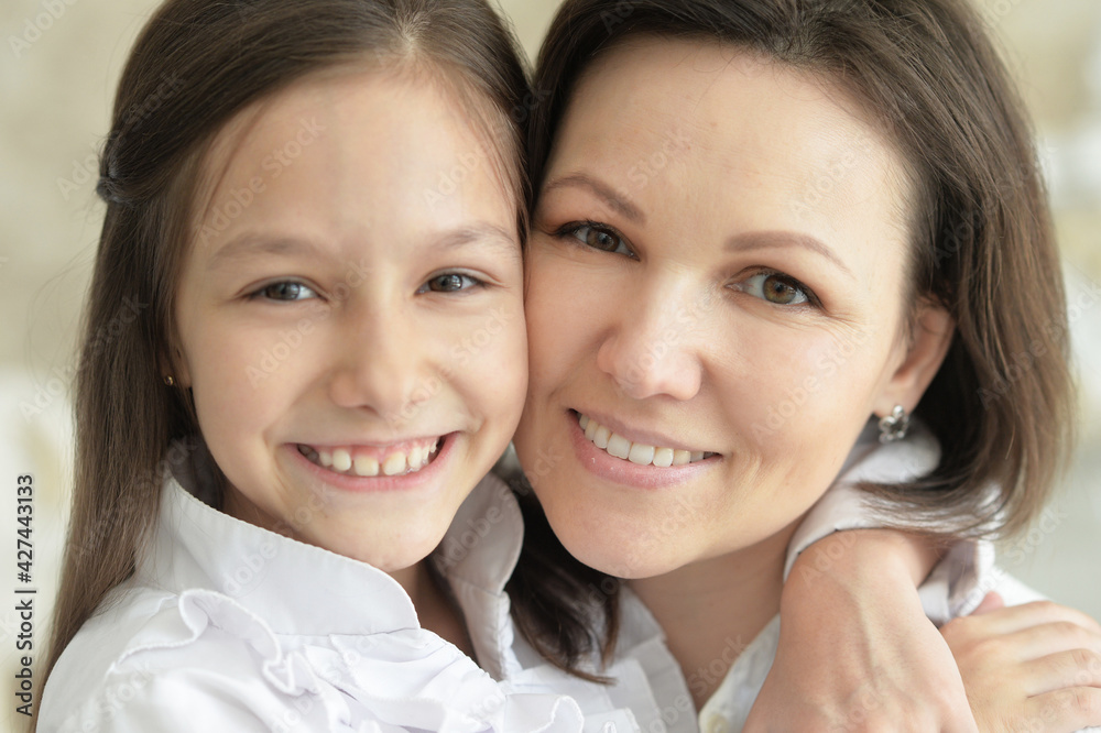 Beautiful young mother and cute little daughter posing Beautiful young mother and cute little daughter posing