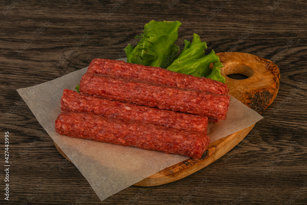 Raw beef sausages with spices Raw beef sausages with spices