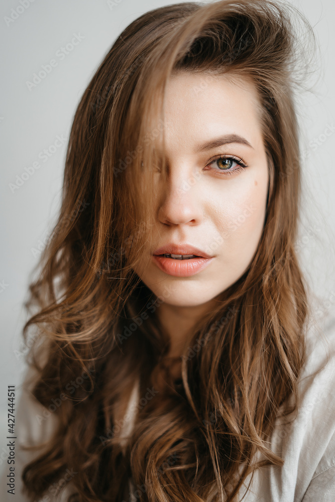 Close-Up Portrait Of Beautiful Young Woman With Healthy Clean Skin On A Face Close-Up Portrait Of Beautiful Young Woman With Healthy Clean Skin On A Face
