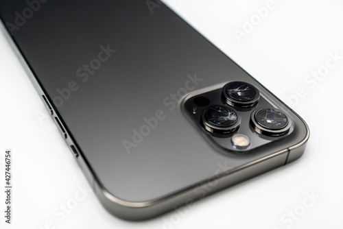 Broken lens on smartphone, isolated white background, back side, lens, camera