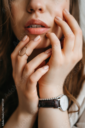 close photo of female hands on face