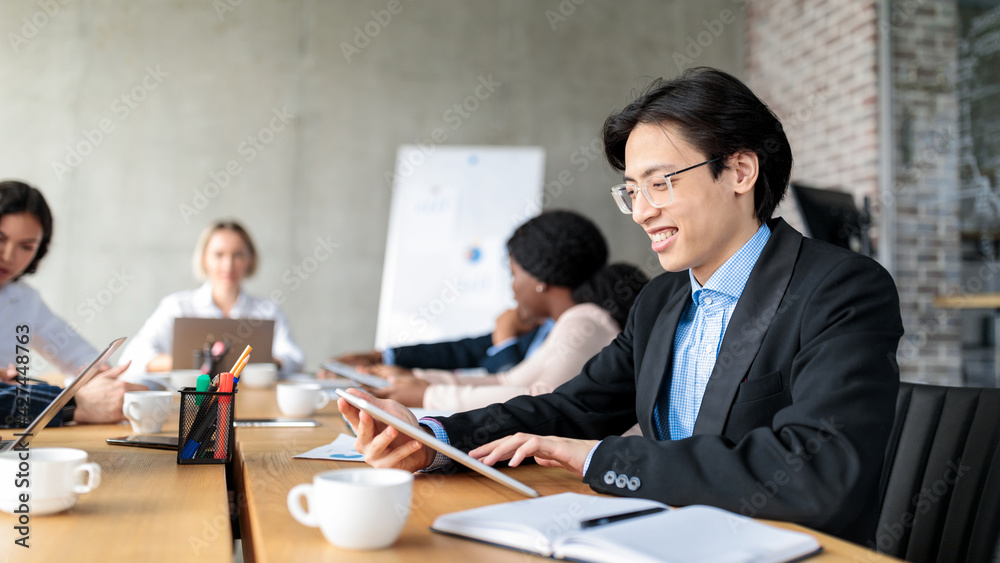 Japanese Businessman Using Tablet Sitting At Corporate Meeting Indoor, Panorama Japanese Businessman Using Tablet Sitting At Corporate Meeting Indoor, Panorama