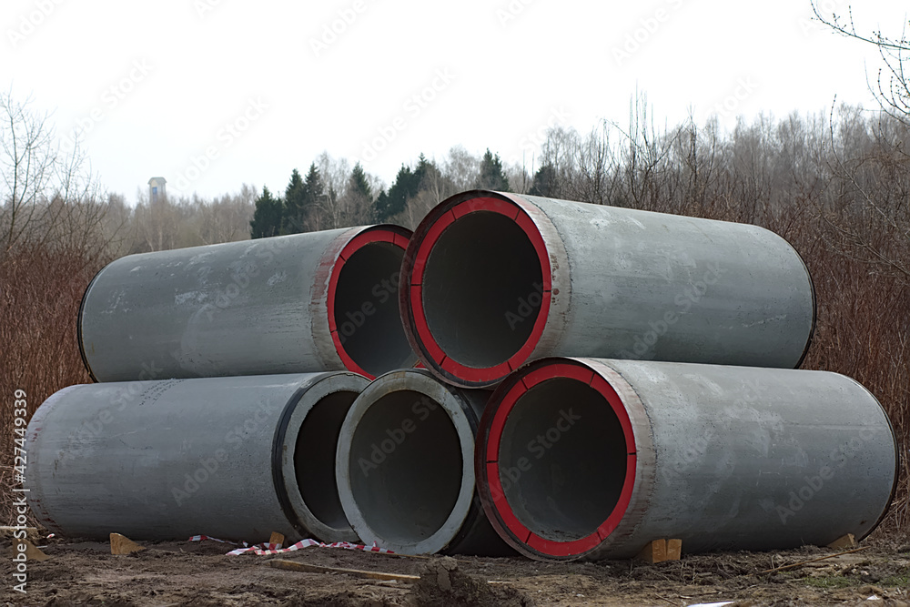 large concrete pipes on the construction site large concrete pipes on the construction site