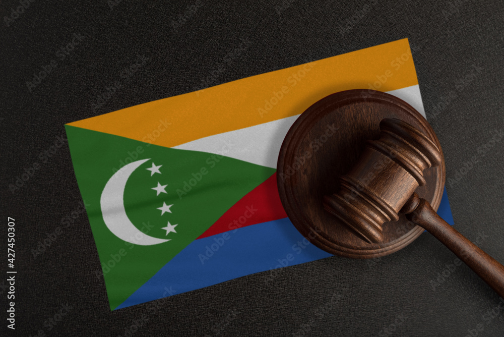 Judges gavel and the flag of Comoros. Law and Justice. Constitutional law