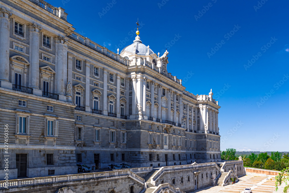 Beautiful view of the north facade of the Royal Palace of Madrid on the blue sky background. Spain.