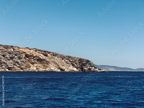 greek island hillside going into the Mediterranean Sea 