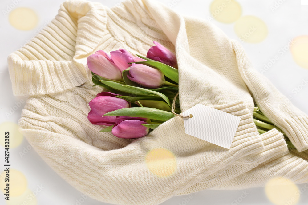 tulips wrapped in a warm wool sweater with empty label