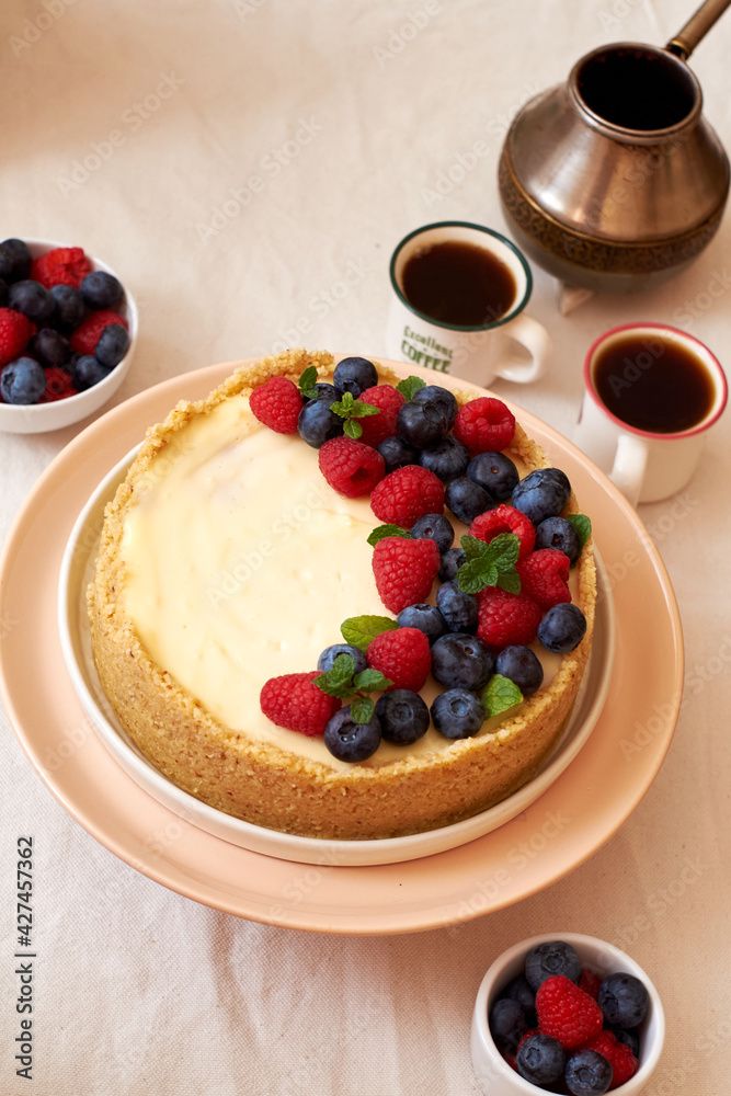 Cheesecake with berries on a white background. Side view. Cheesecake with berries on a white background. Side view.