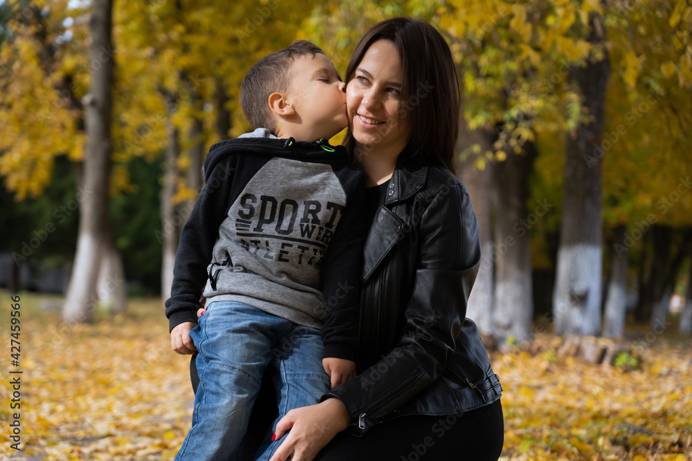 Mother and baby love on autumn sunny day Mother and baby love on autumn sunny day