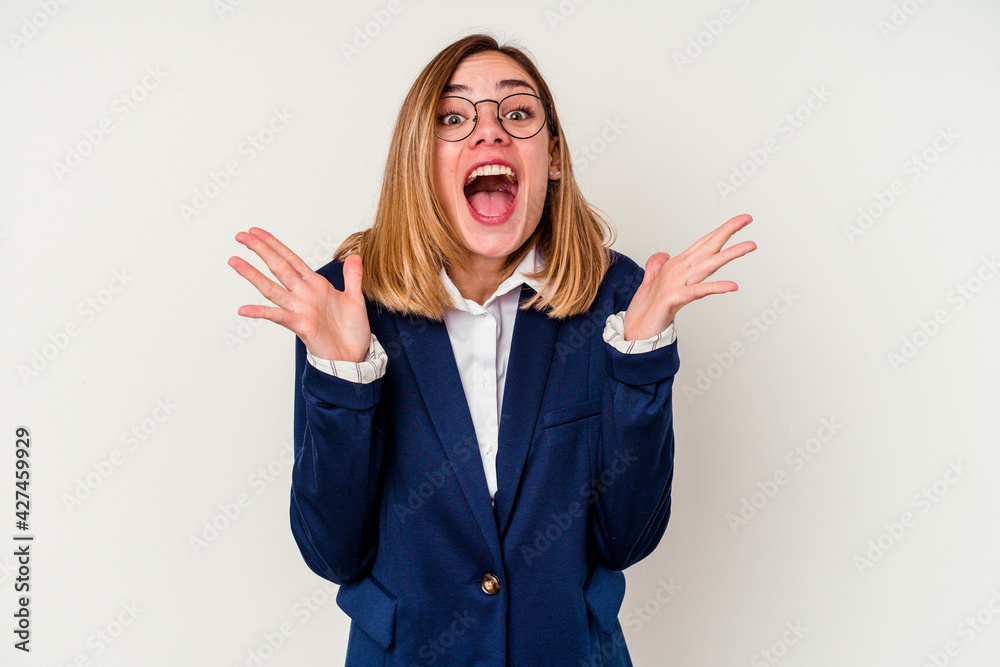 Young business caucasian woman isolated on white background celebrating a victory or success, he is surprised and shocked. Young business caucasian woman isolated on white background celebrating a victory or success, he is surprised and shocked.
