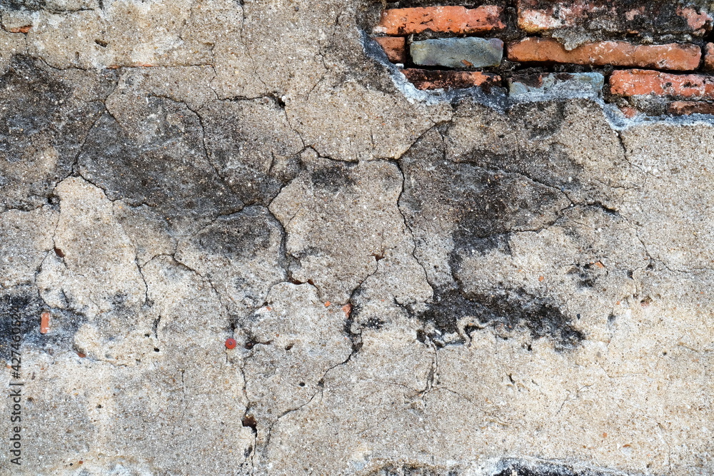 Old Crack Concrete Wall with Red Brick inside Background. Old Crack Concrete Wall with Red Brick inside Background.