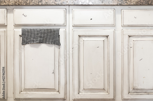Off white rustic kitchen cabinets, front view