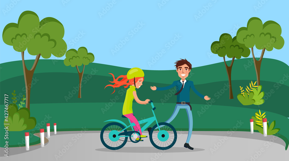 Guy teaches his friend, girl in helmet to ride bike. Man supporting sportswoman on bicycle