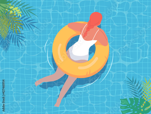 Young woman swimming in the summer pool with yellow lifebuoy 
