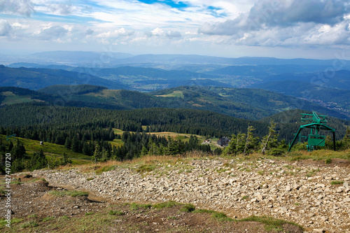 Fototapeta Naklejka Na Ścianę i Meble -  panoramic view of Beskid Zywiecki Mountains and shelter on Hala Miziowa seen from the summit of Pilsko, Poland