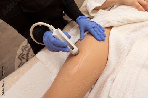 Electroporation body rejuvenation. Anti cellulite procedure  treatment with beauty tools. Salon cosmetic hardware. Medical woman equipment. Beauty and health.