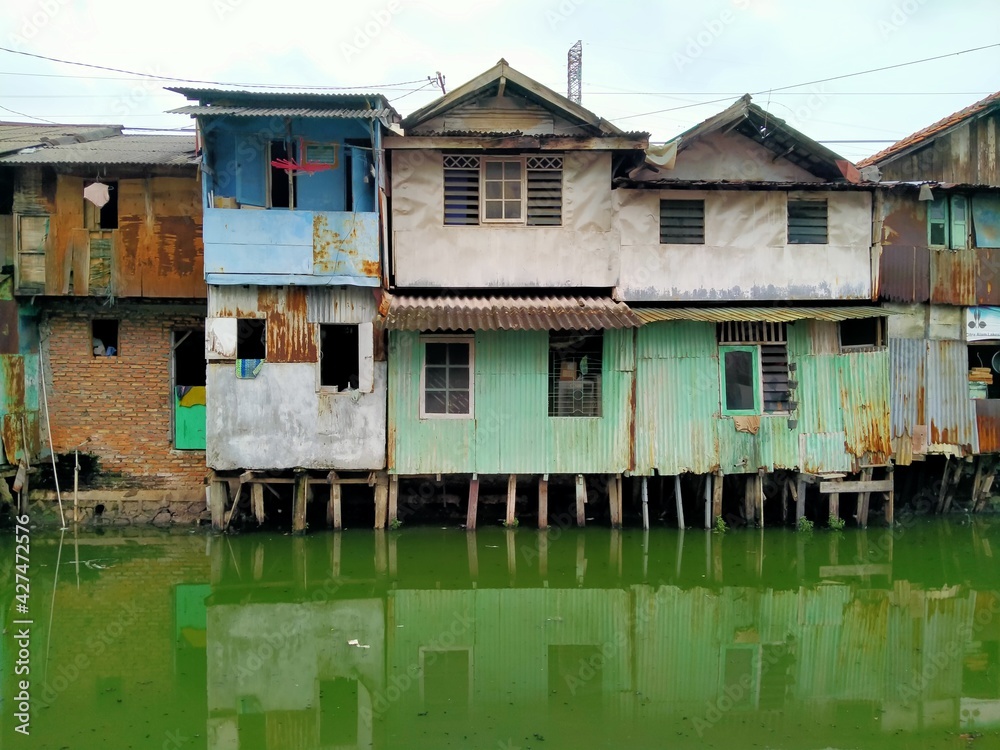 Sungai Duri, Roxy mas, Jakarta, Indonesia - (04-03-2021) :The atmosphere of a densely populated settlement standing on the river bank