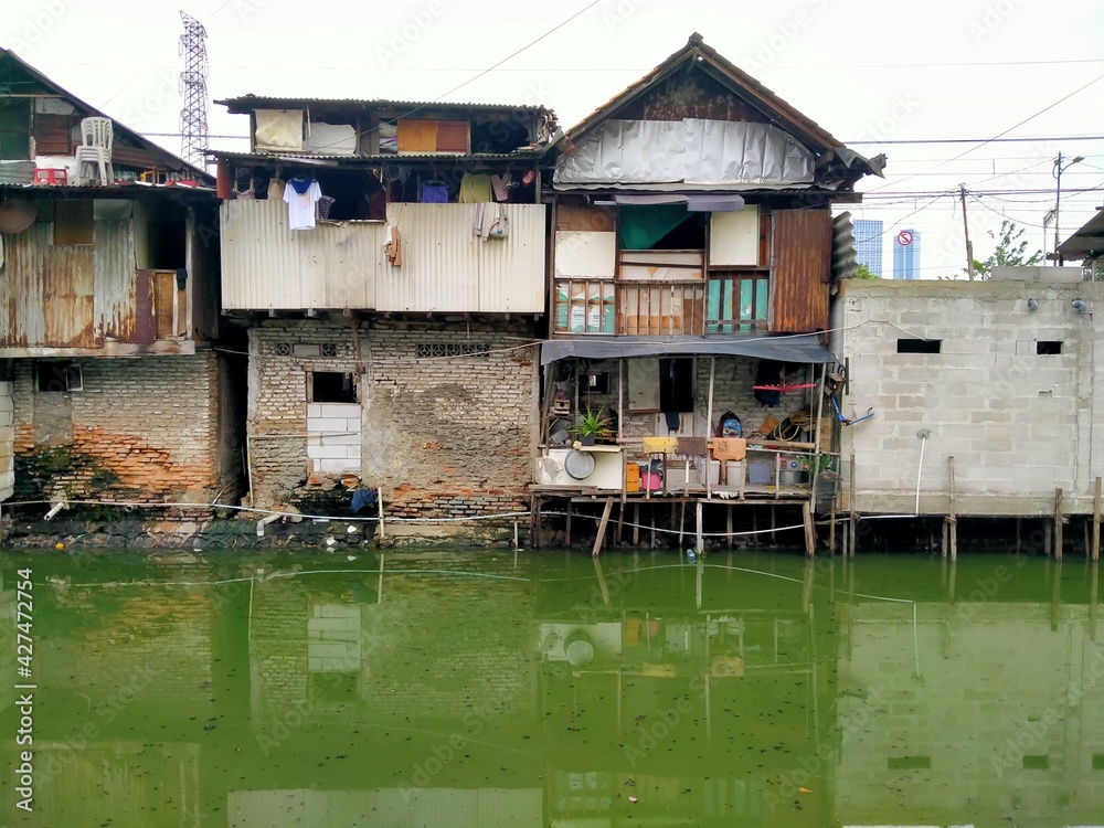 Sungai Duri, Roxy mas, Jakarta, Indonesia - (04-03-2021) :The atmosphere of a densely populated settlement standing on the river bank