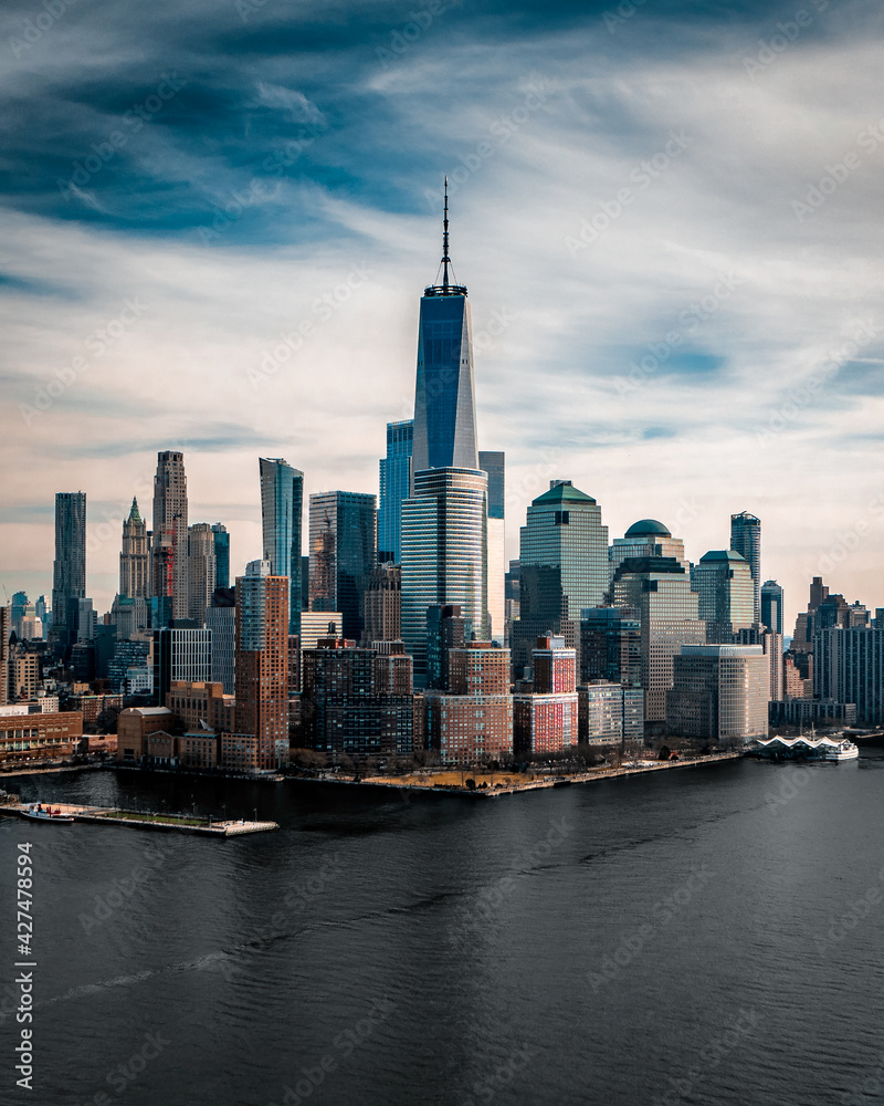 Aerial view of the skyline in New York City with One World Trade Center in Frame seen from the Hoboken Station in New Jersey, USA. Aerial view of the skyline in New York City with One World Trade Center in Frame seen from the Hoboken Station in New Jersey, USA.