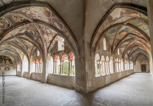 Cloister with fresco paintings of the Cathedral Duomo Santa Maria Assunta (German: Dom Mariae Aufnahme in den Himmel und St. Kassian) of Bressanone - Brixen. Trentino Alto Adige South Tyrol, Südtirol photo