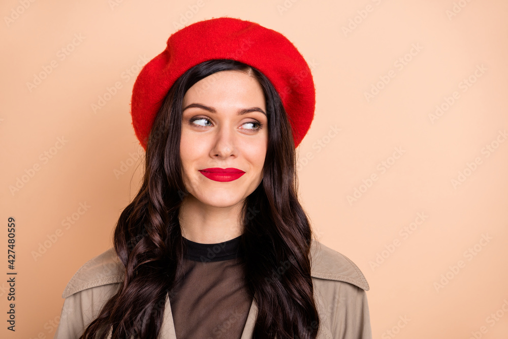 Photo of dreamy beautiful young woman look empty space wear lipstick isolated on beige color background Photo of dreamy beautiful young woman look empty space wear lipstick isolated on beige color background