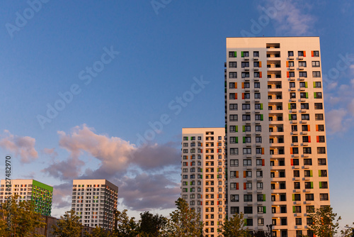 A new district of Moscow stretching into the distance. High apartment buildings on the background of the sky with clouds.