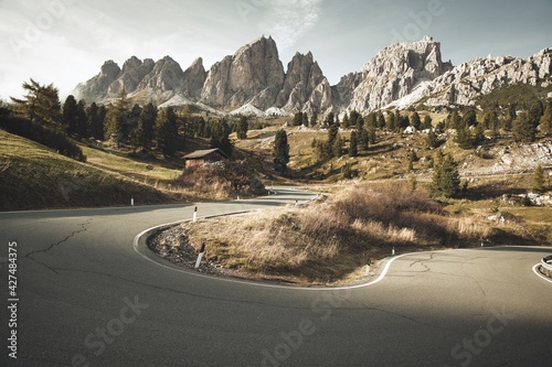 a view of a mountain road in autumn, south tyrol, northern italy