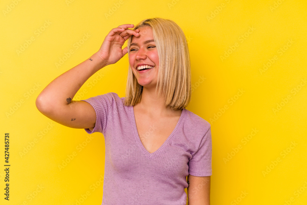 Young venezuelan woman isolated on yellow background joyful laughing a lot. Happiness concept. Young venezuelan woman isolated on yellow background joyful laughing a lot. Happiness concept.
