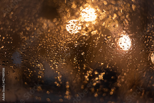 Blurred background with raindrops and lights.