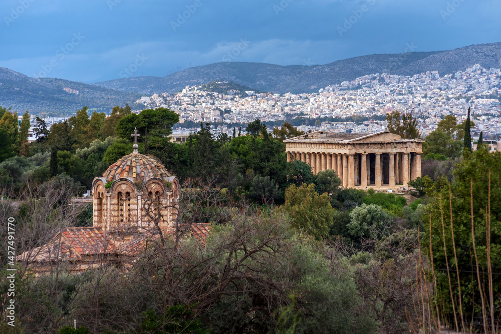 Athens, Attica, Greece. The Temple of Hephaestus or Hephaisteion (also Hephesteum) is an ancient greek temple located at the archaeological site of Agora of Athens. Byzantine church in the foreground
