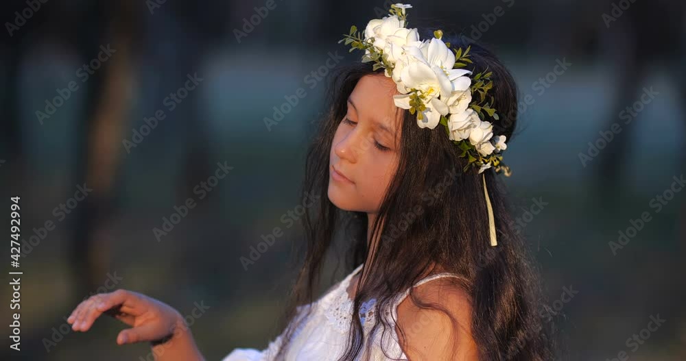 Close-up portrait of a Caucasian teenager girl with long brown hair and ...
