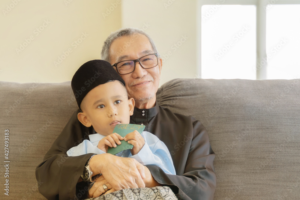 Eid Mubarak celebration moment, grand father with grand son Eid Mubarak celebration moment, grand father with grand son