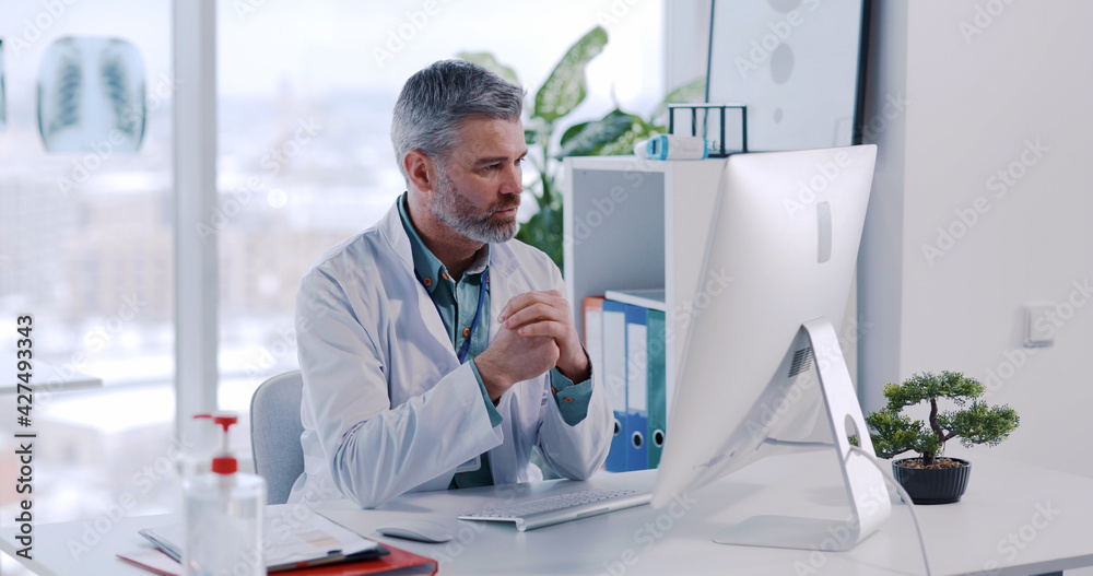Adult caucasian doctor consulting distant customer patient online during quarantine. Modern professional therapist surgeon recording healthy medical videovlog. Hospitals. Healthcare.