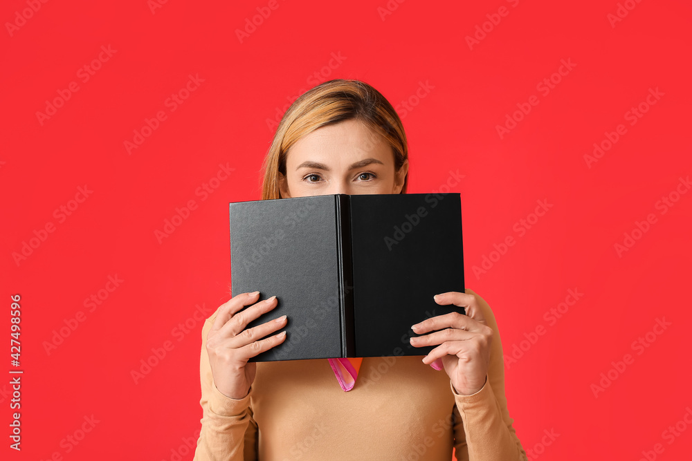 Woman with book on color background Woman with book on color background