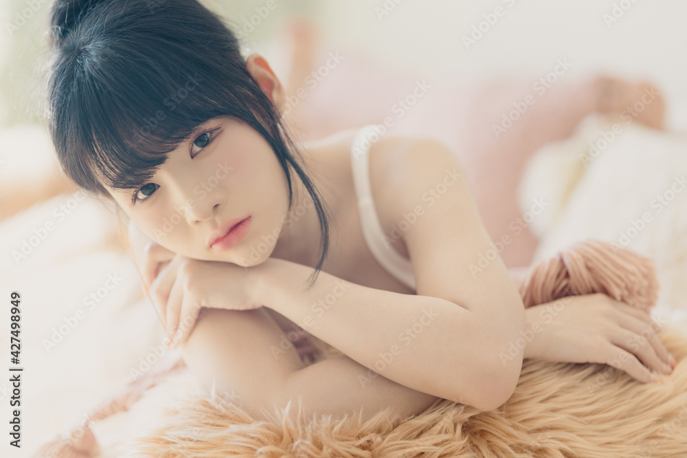 Naklejka premium Headshot portrait of young asian woman sexy girl with long hair using as background cosmetics woman makeup fashion people model