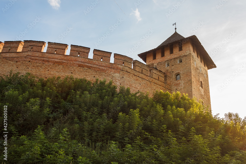 The medieval castle is illuminated by the sunset. Lutsk High Castle, also known as Lubart's Castle. Ukraine	