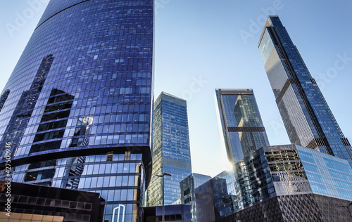 The glass skyscrapers of the business center  photographed from a low angle.