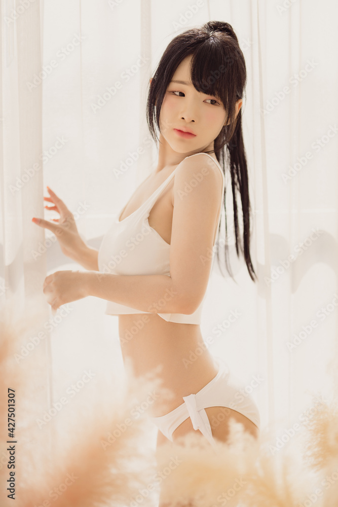 Naklejka premium Headshot portrait of young asian woman sexy girl with long hair using as background cosmetics woman makeup fashion people model