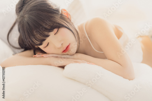 Headshot portrait of young asian woman sexy girl sleeping with long hair using as background cosmetics woman makeup fashion people model