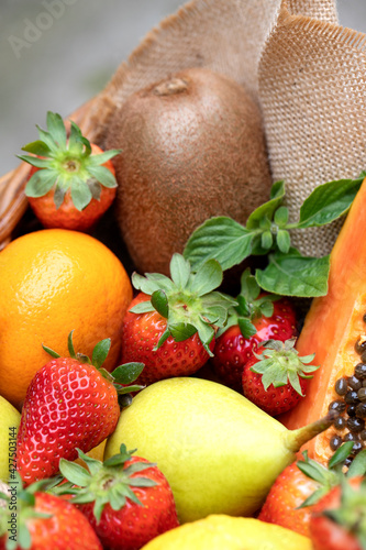 Fruits on plate. Wooden surface