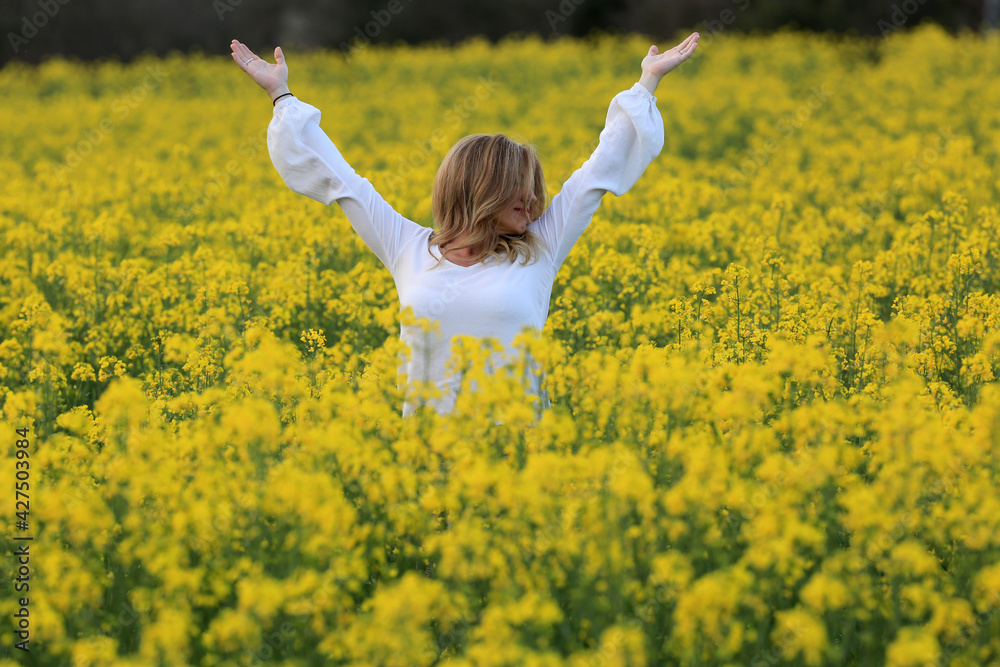 woman portrait with yellow flowers field background woman portrait with yellow flowers field background