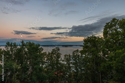 Amazing beauty sunset on sea on blue sky with white clouds. Beautiful summer nature backgrounds. Sweden.