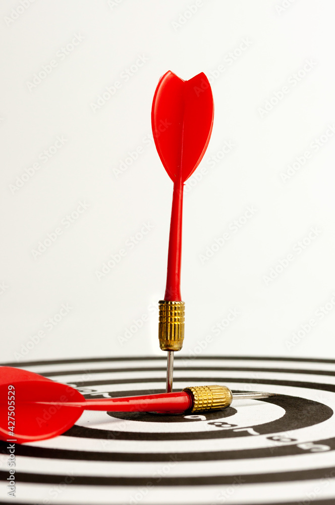 Red arrow hit on target dart board, business strategy planning to success goal. Red arrow hit on target dart board, business strategy planning to success goal.