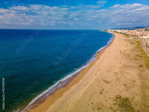 Aerial images with drone of Malgrat de Mar beach in Maresme Barcelona European tourism Spectacular cinematic plane aerial view turquoise water © Osvaldo Mussi