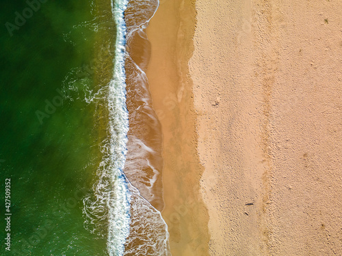 Aerial images with drone of Malgrat de Mar beach in Maresme Barcelona European tourism Spectacular cinematic plane aerial view turquoise water