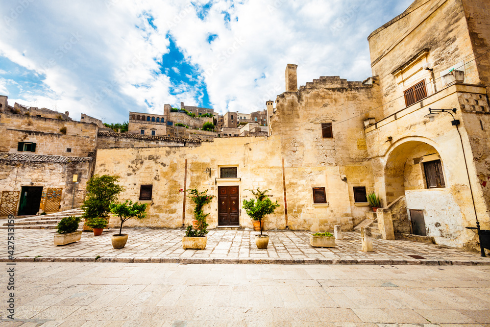 Old Italian stone buildings. Matera, Italy. Beautiful scene of the ancient city at Matera in Italy. Ancient and historical homes. Southern Italy.